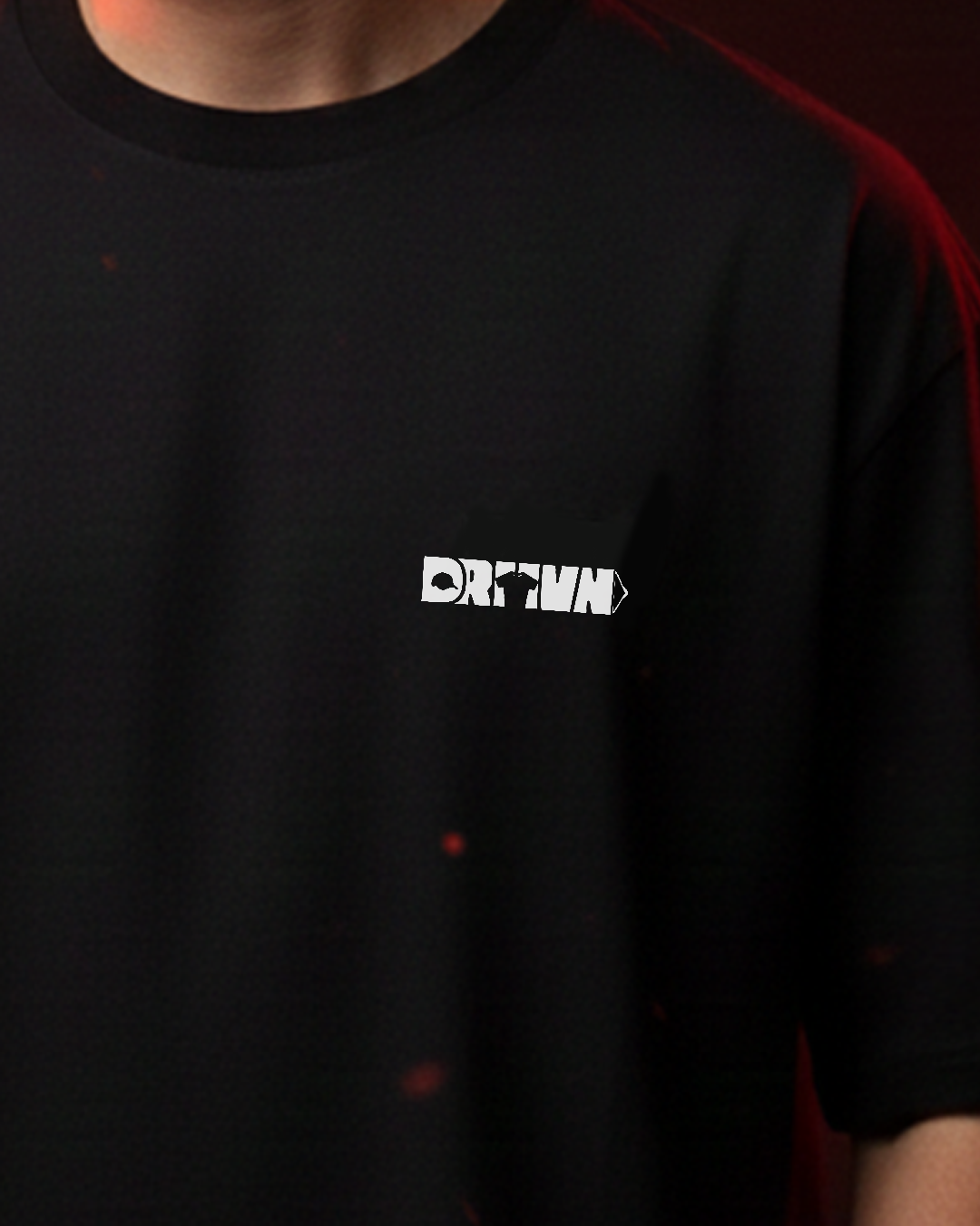 Black t-shirt with a white logo on a dark background