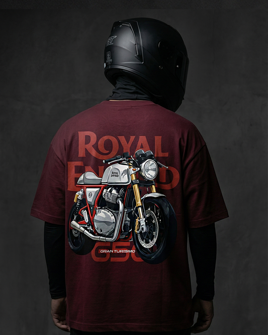 Person wearing a maroon t-shirt with a motorcycle graphic and 'Royal Enfield' branding on the back, against a dark background.