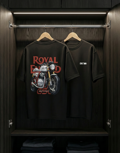 Black t-shirt with 'Royal Enfield' logo on a hanger inside a wooden wardrobe.