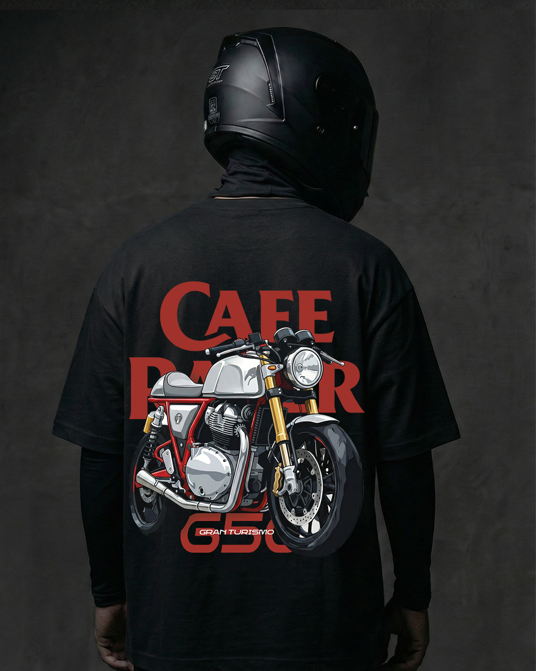 Person wearing a black t-shirt with a graphic of a cafe racer motorcycle and 'Cafe Racer' text on a dark background.