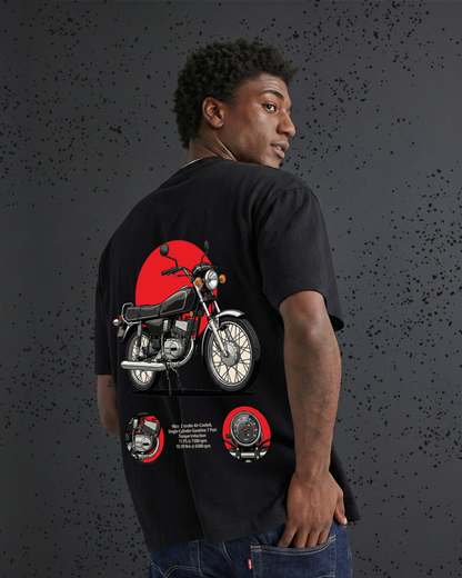 Person wearing a black t-shirt with a motorcycle graphic on the back against a dark textured background