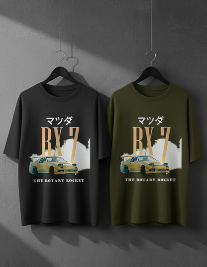 Two Mazda RX-7 t-shirts on hangers against a gray background