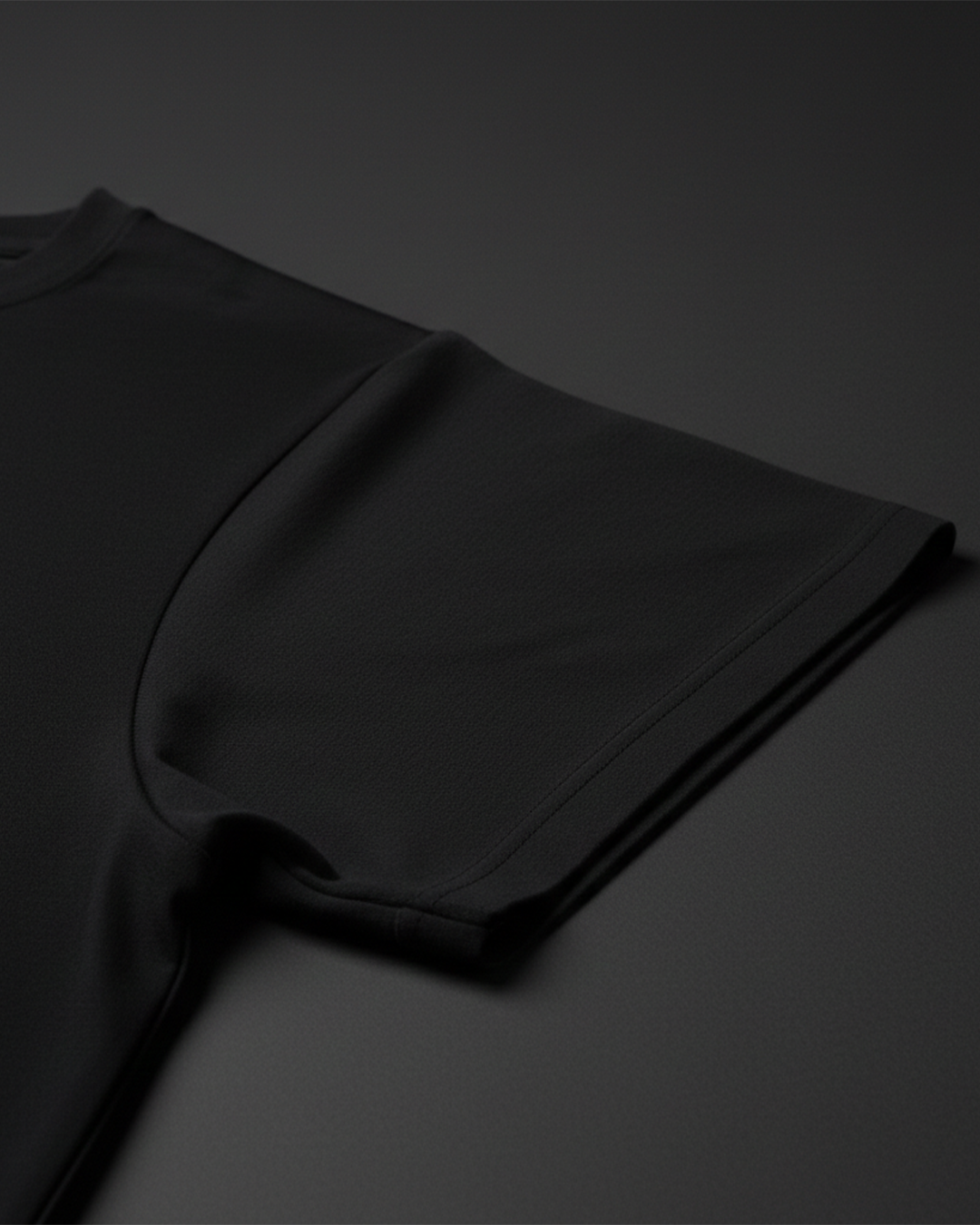 Black t-shirt on a dark gray background